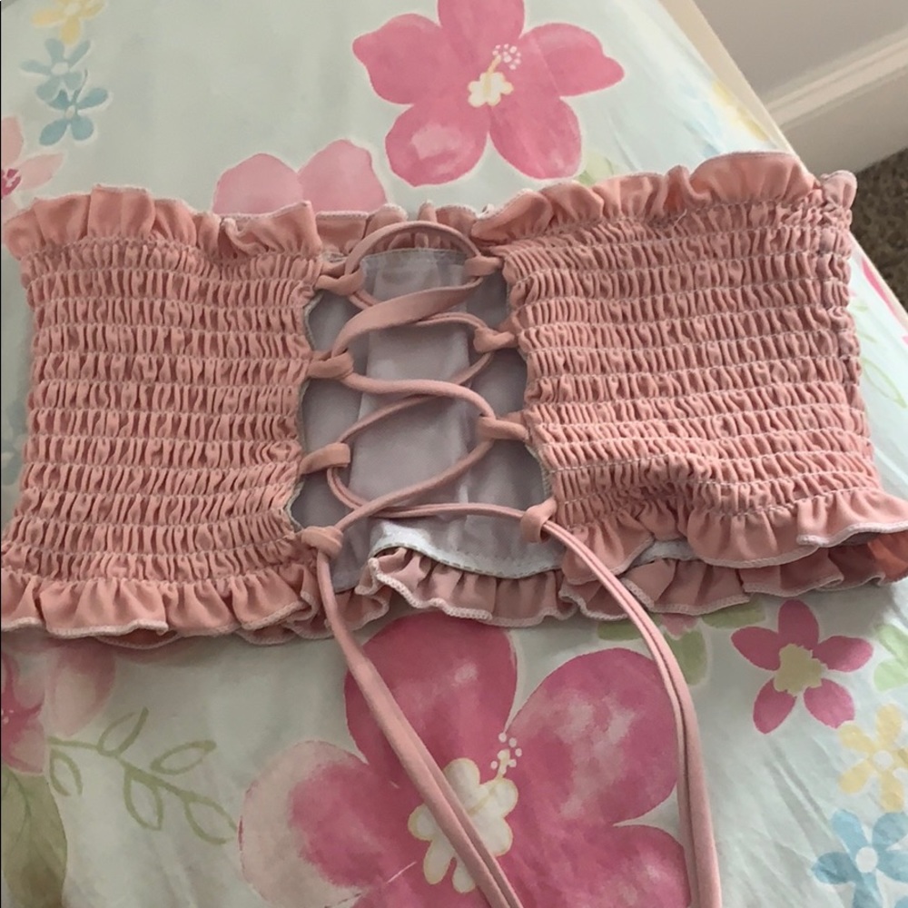 a pink bikini top